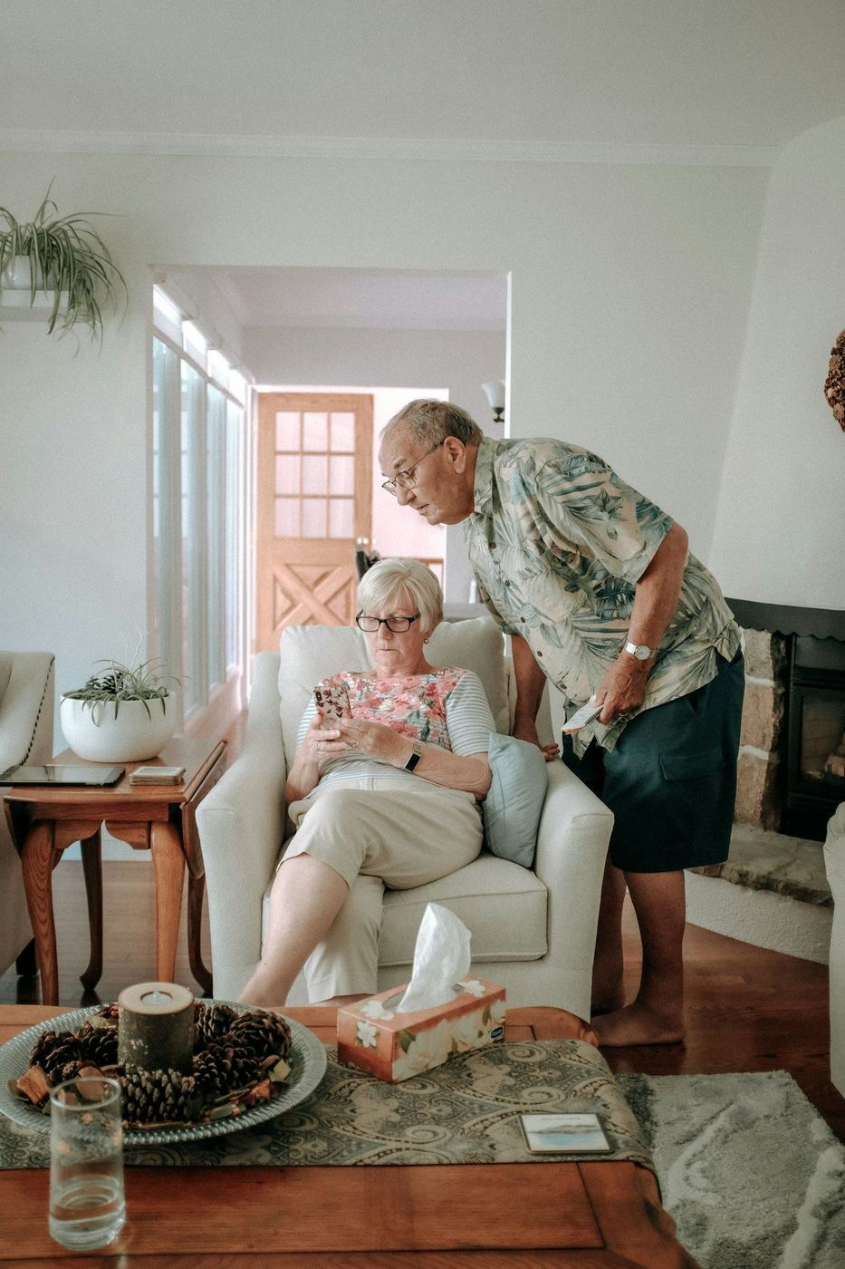 An older couple comfortable together at home, supported by A&D Waiver in-home care